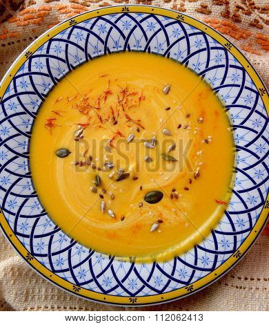 pumpkin cream soup with seeds and saffron
