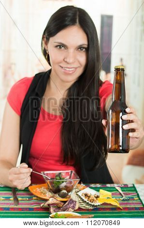 Beautiful young brunette girl enjoying a seafood cebiche