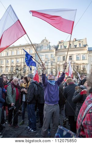 CRACOW POLAND - DECEMBER 19 2015: Cracow Main Square - The demonstration of the Committee of the Defence Protection of the Democracy against the break of law through the government PIS in Poland.