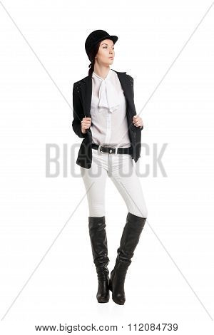 Young woman in riding clothes
