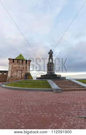 Nizhny Novgorod, Russia - November 11 2015. View of  Kremlin's St. George Tower and a monument to  p