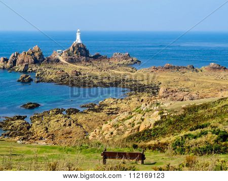 Lighthouse on the rocky coast of Jersey Island