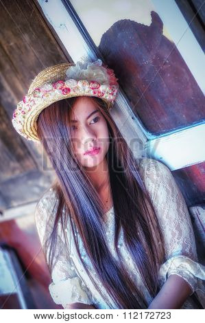Asia Beautiful Woman Sitting On Wood Chair