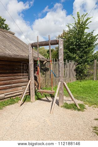 Old Wooden Swing In The Russian Village