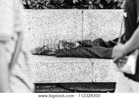 Homeless People Sleeping At Streetside In City, Black And White.