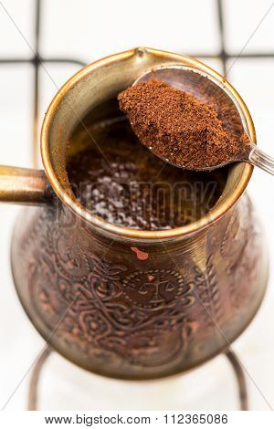 Turkish Pot Cezve And Spoon With Ground Coffee, Close-up, Top View