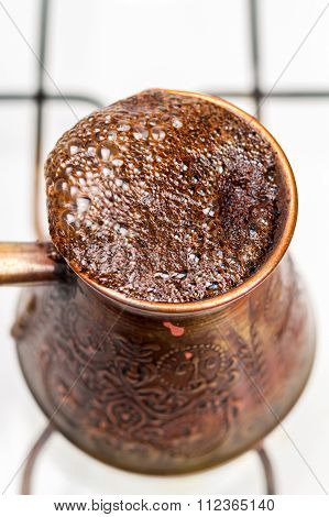 Coffee Brewing In Turkish Pot Cezve. Close-up, Top View