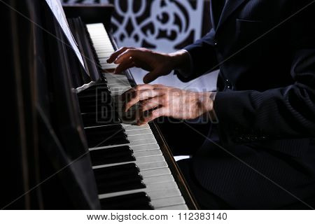 Close up of musician hands classic piano playing