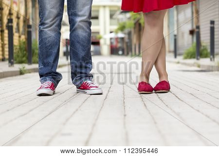 Young Couple Standing Outdoor. Male And Female Legs.