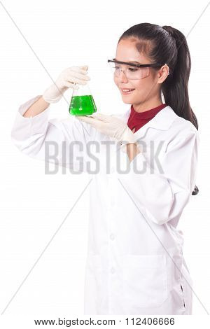emale medical or scientific researcher holding at a liquid solution in a lab.