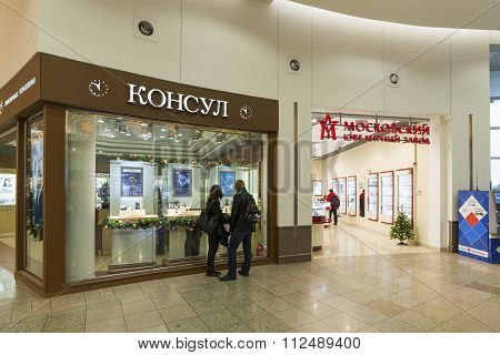 Khimki, Russia - December 22, 2015. The buyer at the shop window in  mall Mega croup