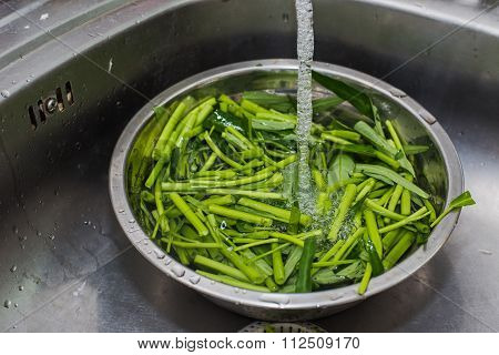 Fresh Vegetables Under Water On A Bowl