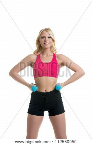 Sportive blonde with dumbbells. Isolated on white