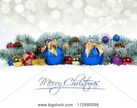 Christmas Baubles And Blue Balls With Snow Fir Tree