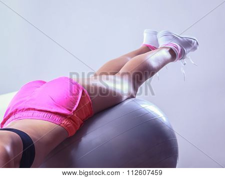 Woman Doing Fitness Exercises With Fit Ball