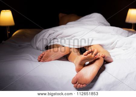 Couple sleeping in bed