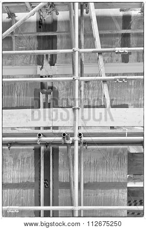 A Construction Site With Concrete Slabs Built Held Together With Scaffolding