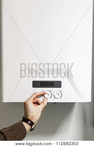 Man Regulate Heating Boiler Control Panel