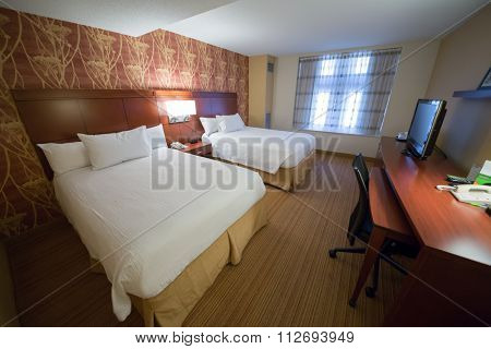 USA, NEW-YORK - 30 AUG, 2014: Light room with a two double bed and TV in Courtyard Washington Convention Center.