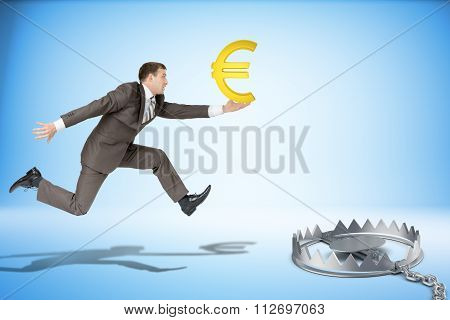 Businessman running forward with euro sign