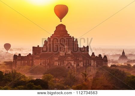 Sunrise over Dhammayangyi temples with hot air balloon Bagan Myanmar.