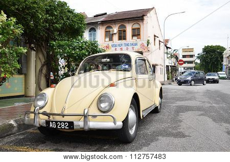 Classic Vw Beetle Parked On The Roadside Of Ipoh Town, Malaysia