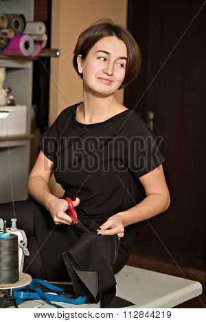 The Girl Seamstress Working