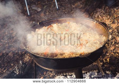 Cast Iron Pot Outdoors, Cooking On A Fire.