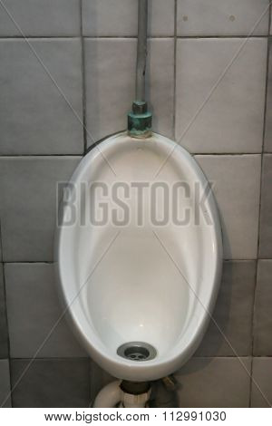 Mens Urinal Toilet In A Restaurant Bathroom