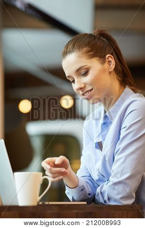 Business woman making a time out sign at the office