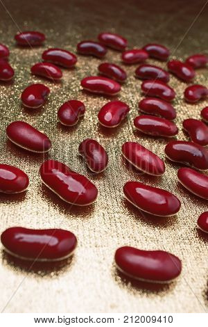 Red Beans On A Golden Background, Vertical Frame