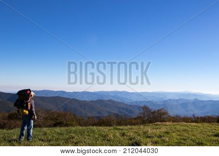 Hiker overlooking the appalachian mountains stretching into the distance