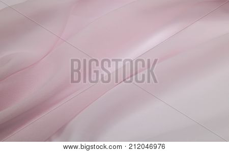 a delicate faux silk fabric pale pink color lined with soft folds