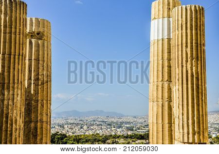 VIEW OF THE CITY OF ATHENS BETWEEN COLUMNS FROM THE ACROPOLIS