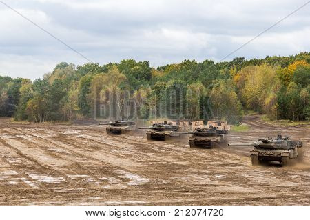 german main battle tanks drives on battlefield