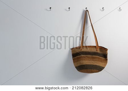 Bag hanging on hook against wall