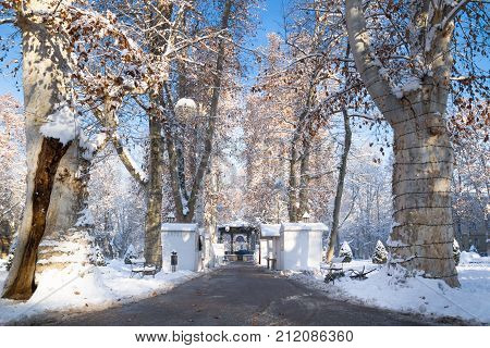 Advent market with closed foodstallt and sunny weather and blue sky with snow in Zrinjevac Park in Zagreb in winter, Croatia, Europe