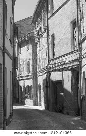 Montefano (Macerata Marches Italy) old buildings in the historic town. Black and white