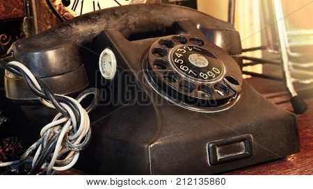Closeup Of Black Retro Vintage Telephone With Rotary Dialer Or Dialpad. Local Vintage Telephone For