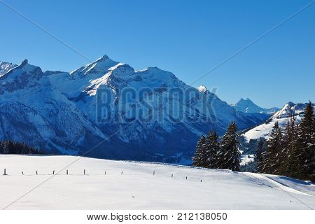 Winter day in the Swiss Alps. View from mount Hohe Wispile.