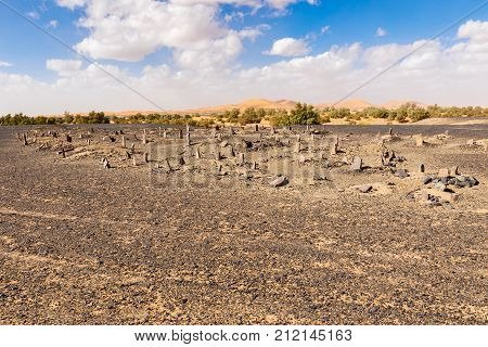 Berber old cemetery at abandoned mining village on edge of the Sahara desert in Morocco.