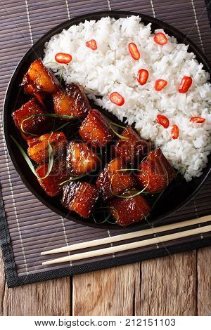 Glazed Pork Belly With Rice Close-up On A Plate. Vertical Top View