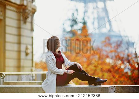 Young Woman In Paris Near The Eiffel Tower