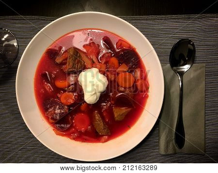 Borsch - beetroot soup in a bowl, traditional dish of ukrainian and RUssian cuisine , aka Borscht or Borschtsch. Top view.