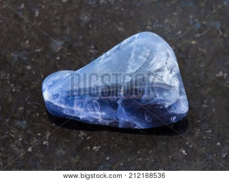 Polished Dumortierite Gemstone On Dark Background