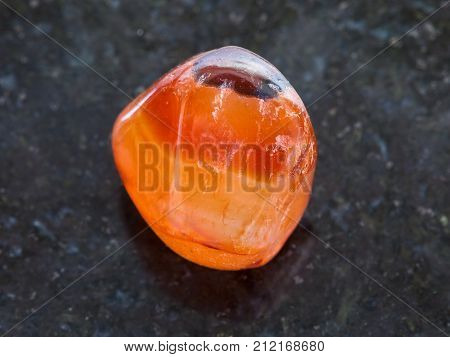 Tumbled Carnelian Gem Stone On Dark Background