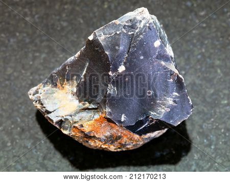 Rough Black Flint Stone On Dark