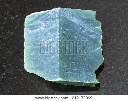 Rough Nephrite Stone Slab On Dark Background