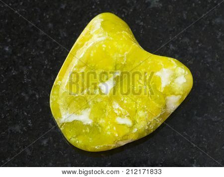 Polished Yellow Lizardite Gemstone On Dark