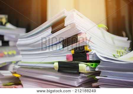 Paper stack Pile of unfinished documents on office desk related to business functions. Stack of business papers for Annual Report files  Business offices concept.